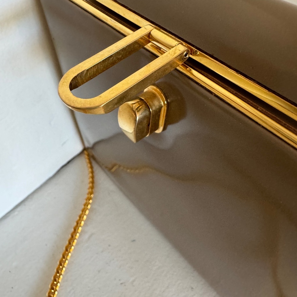 Tan Vintage purse. Latch/snap closure. Made in Italy.